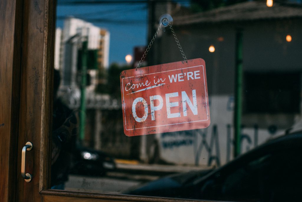 Asset finance Image of a store sign reading 'come in, we're open'