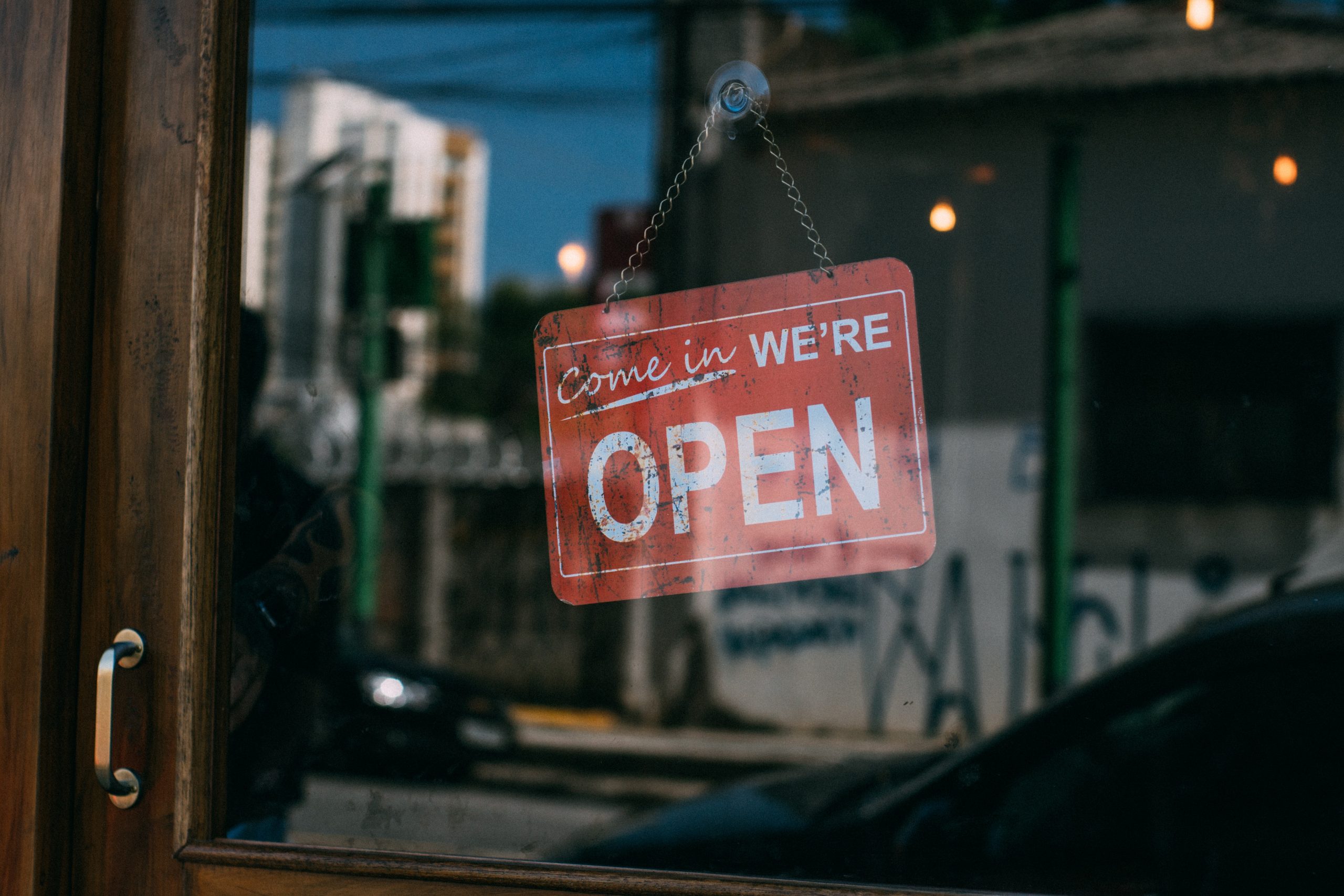 Asset finance Image of a store sign reading 'come in, we're open'