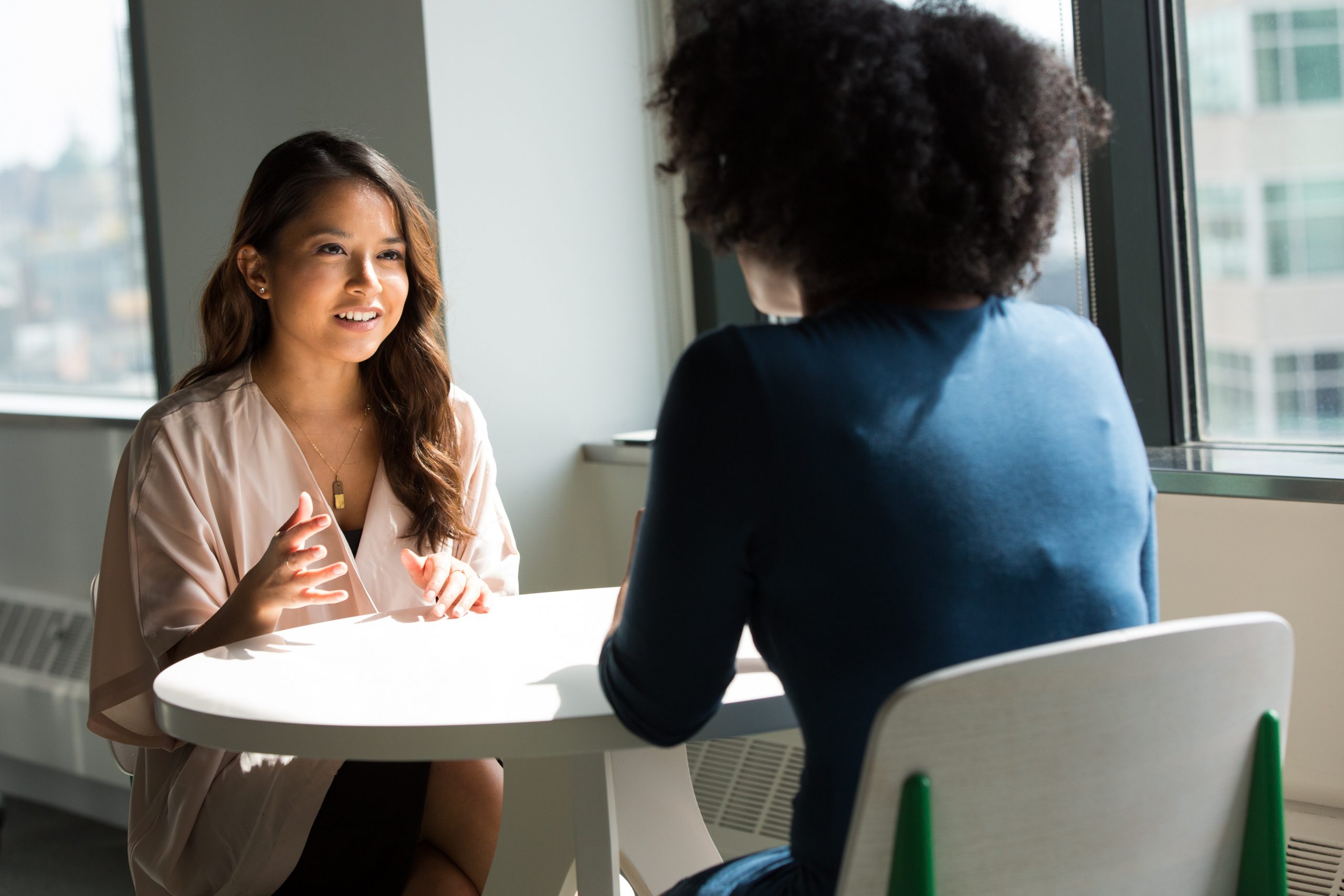 women discussing debt restructuring